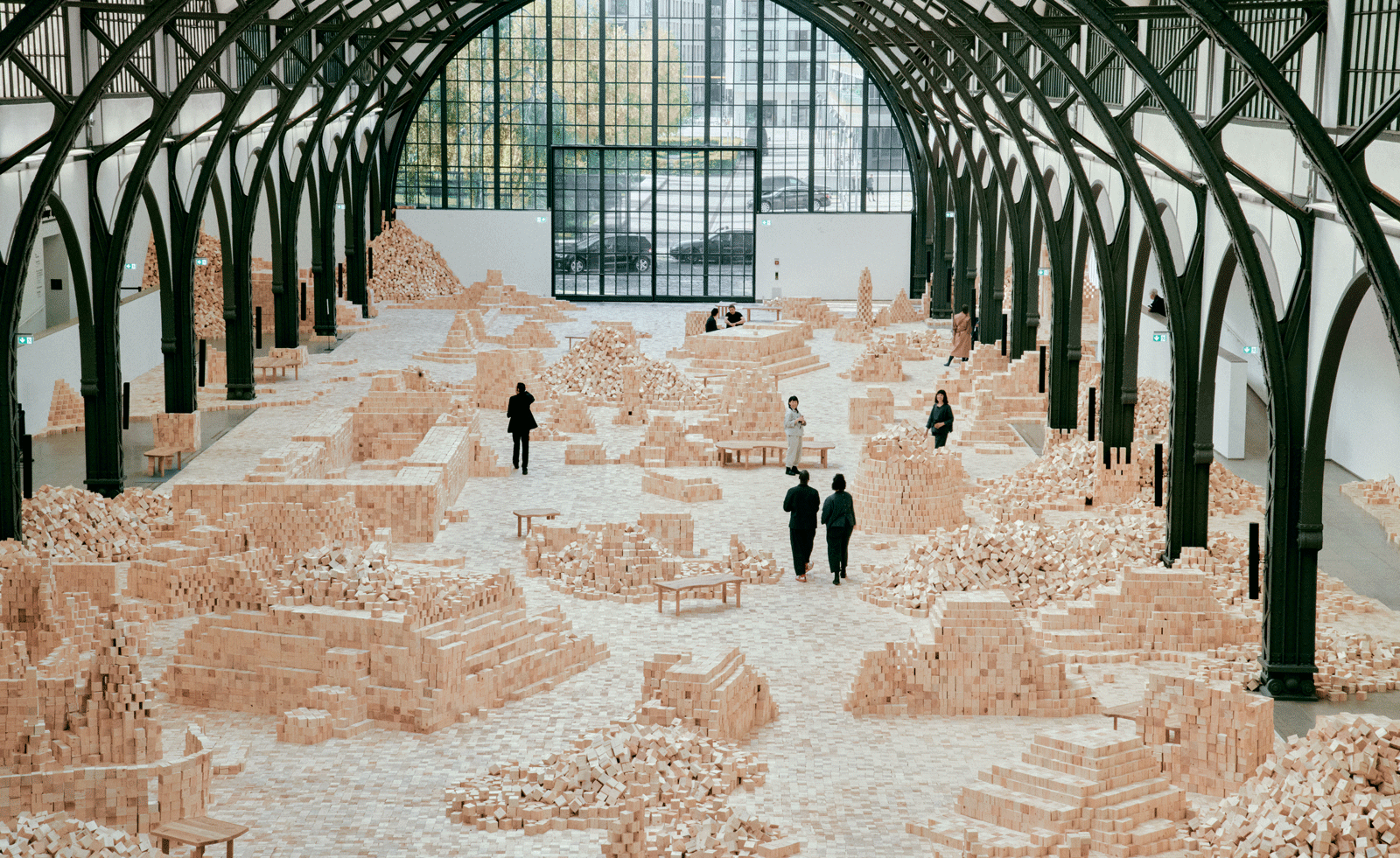 Wooden cubes strewn across gallery space for Lina Lapelyte&rsquo;s &lsquo;We Make Years Out of Hours&rsquo; exhibition at Hamburger Bahnhof in Berlin